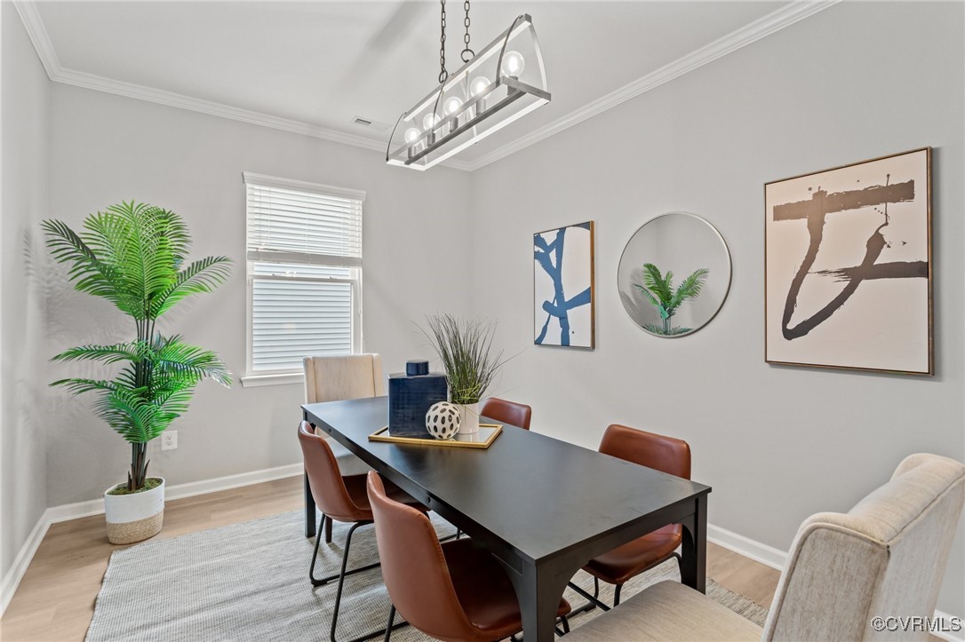 15624 Cedarville Drive Midlothian, VA 23112 - Photo 17 of 49 a view of a dining room with furniture window and wooden floor
