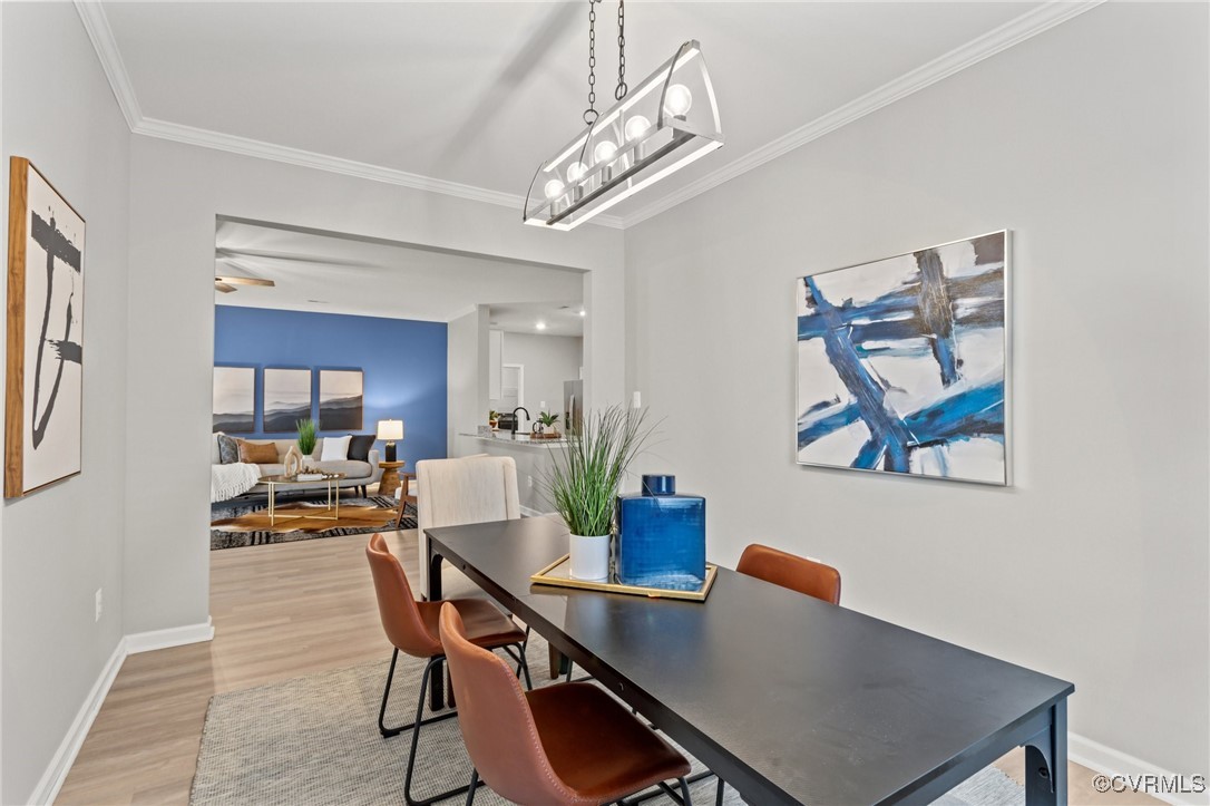 15624 Cedarville Drive Midlothian, VA 23112 - Photo 18 of 49 a view of a dining room with furniture wooden floor and a chandelier