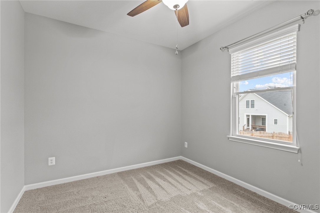 15624 Cedarville Drive Midlothian, VA 23112 - Photo 19 of 49 an empty room with windows and fan