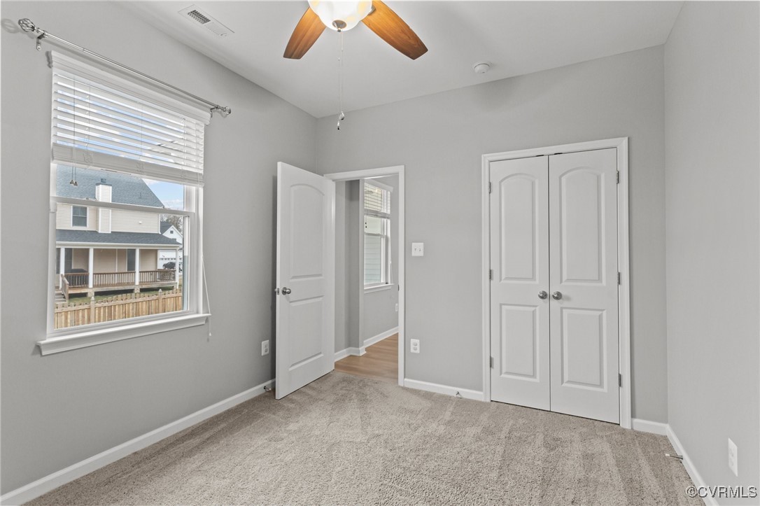 15624 Cedarville Drive Midlothian, VA 23112 - Photo 20 of 49 an empty room with windows and closet
