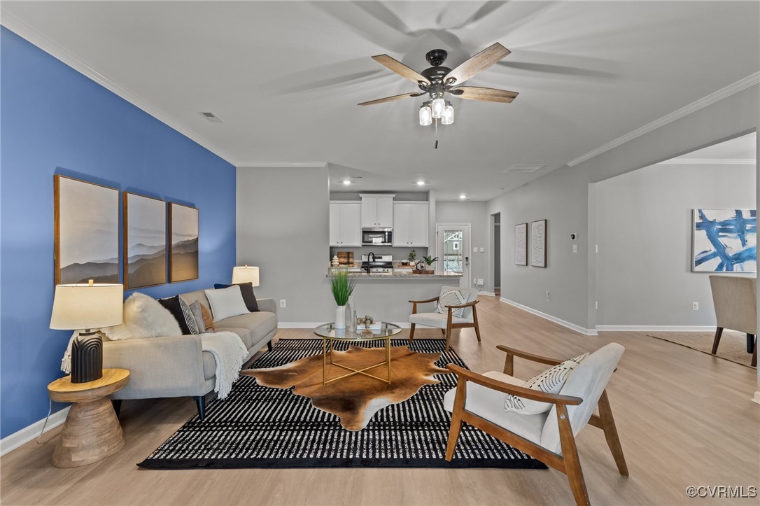 15624 Cedarville Drive Midlothian, VA 23112 - Photo 21 of 49 a living room with furniture and a chandelier