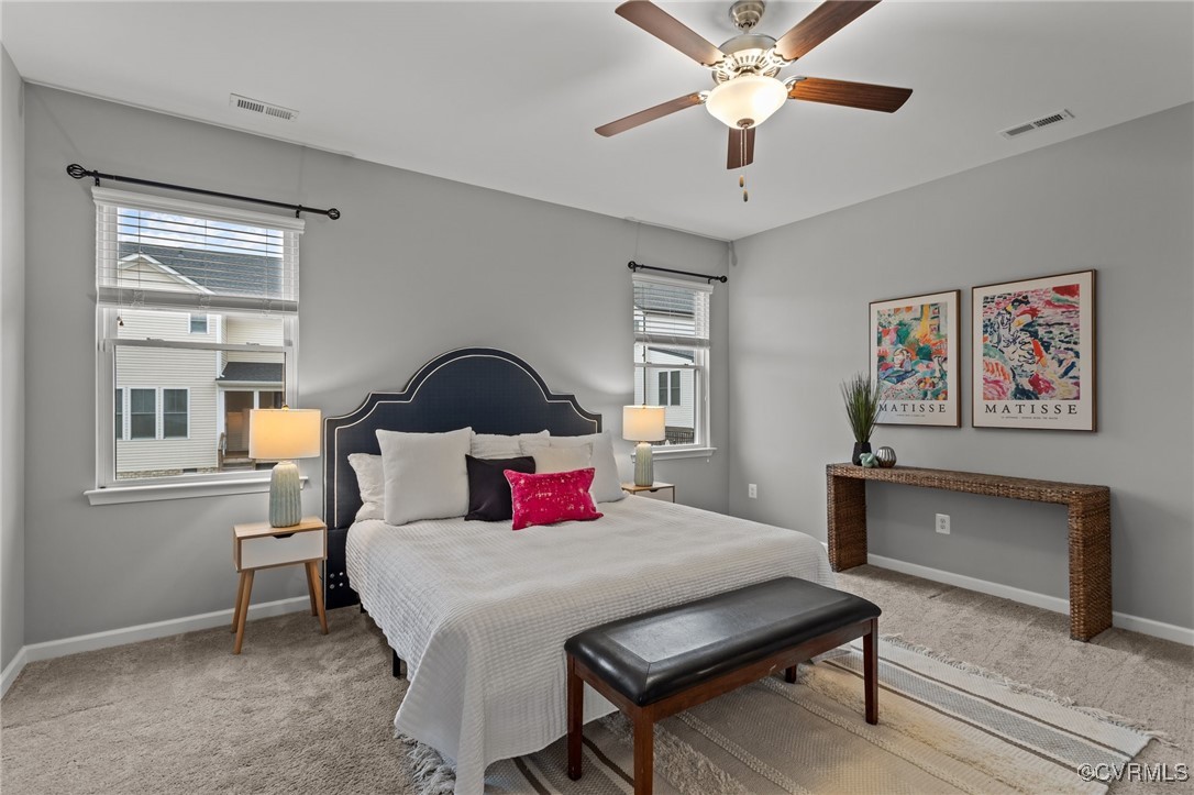 15624 Cedarville Drive Midlothian, VA 23112 - Photo 23 of 49 a bedroom with a bed and a chandelier