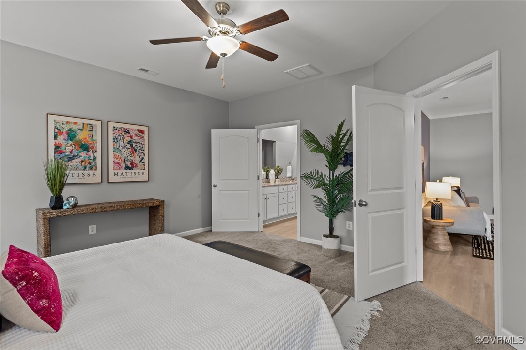 15624 Cedarville Drive Midlothian, VA 23112 - Photo 24 of 49 a bedroom with a bed and a chandelier