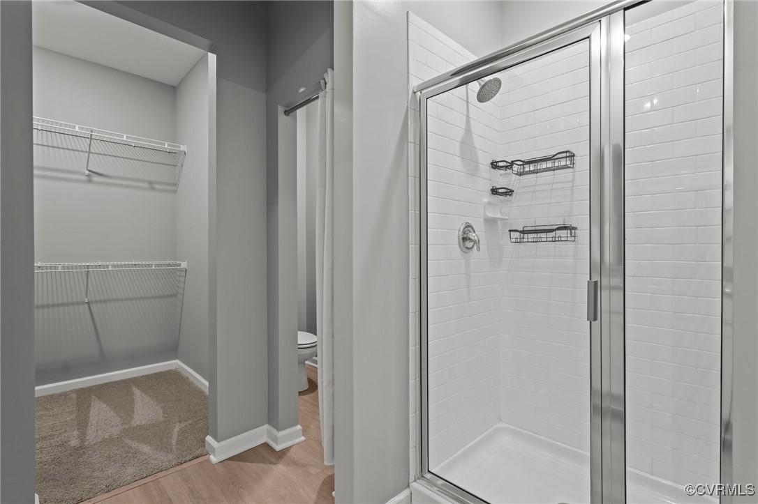 15624 Cedarville Drive Midlothian, VA 23112 - Photo 27 of 49 a bathroom with a shower and a glass door