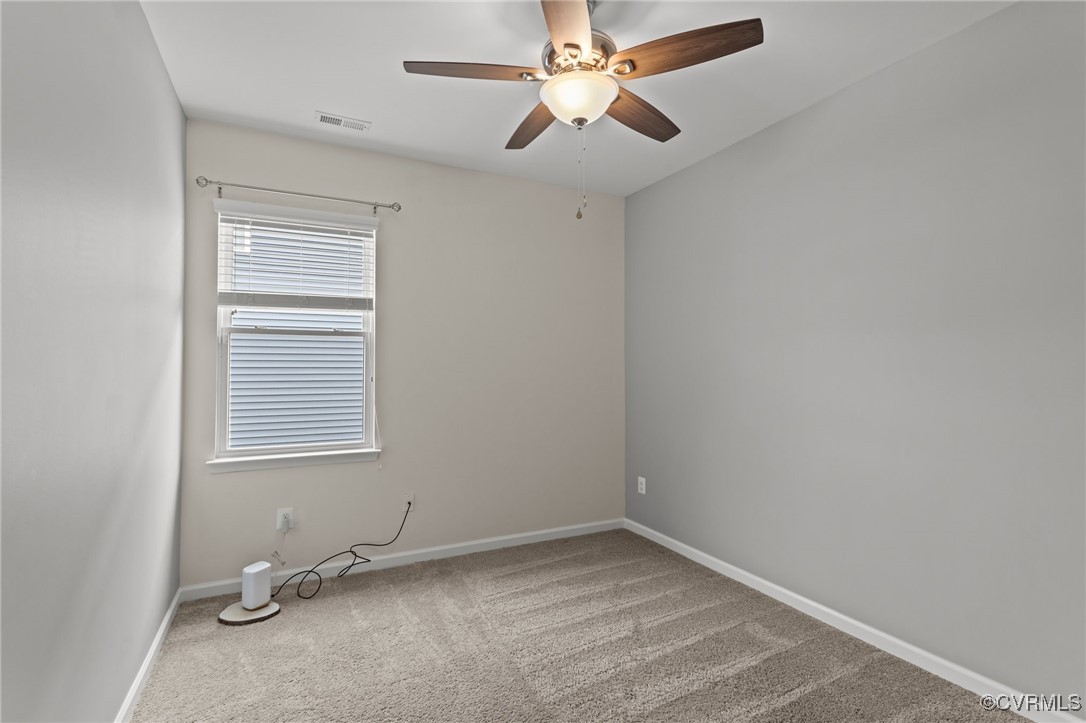 15624 Cedarville Drive Midlothian, VA 23112 - Photo 30 of 49 an empty room with a window and a fan