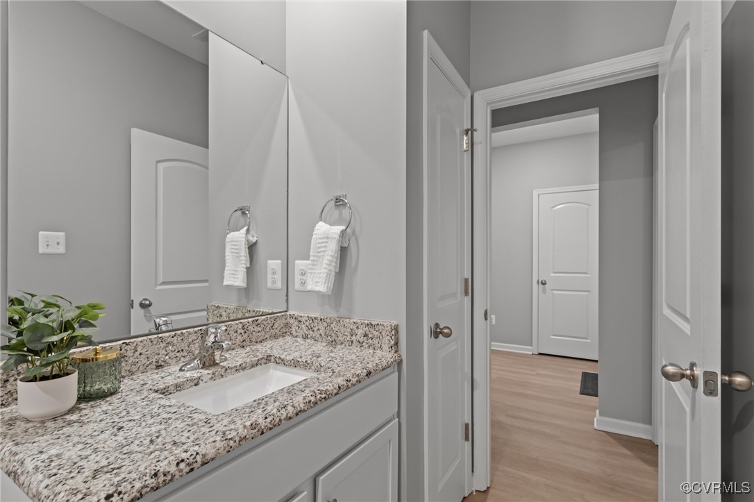 15624 Cedarville Drive Midlothian, VA 23112 - Photo 33 of 49 a bathroom with a granite countertop sink and a mirror