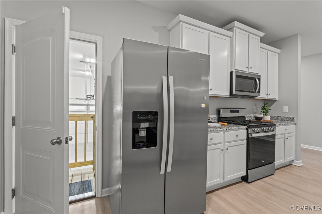 15624 Cedarville Drive Midlothian, VA 23112 - Photo 10 of 49 a kitchen with stainless steel appliances granite countertop a refrigerator and a stove top oven