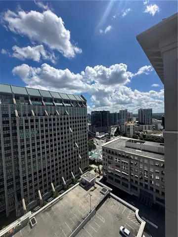 a view of a patio with a table and chairs