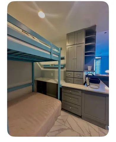 a kitchen with a refrigerator and cabinets