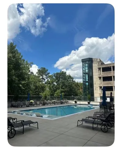 a view of swimming pool from a balcony