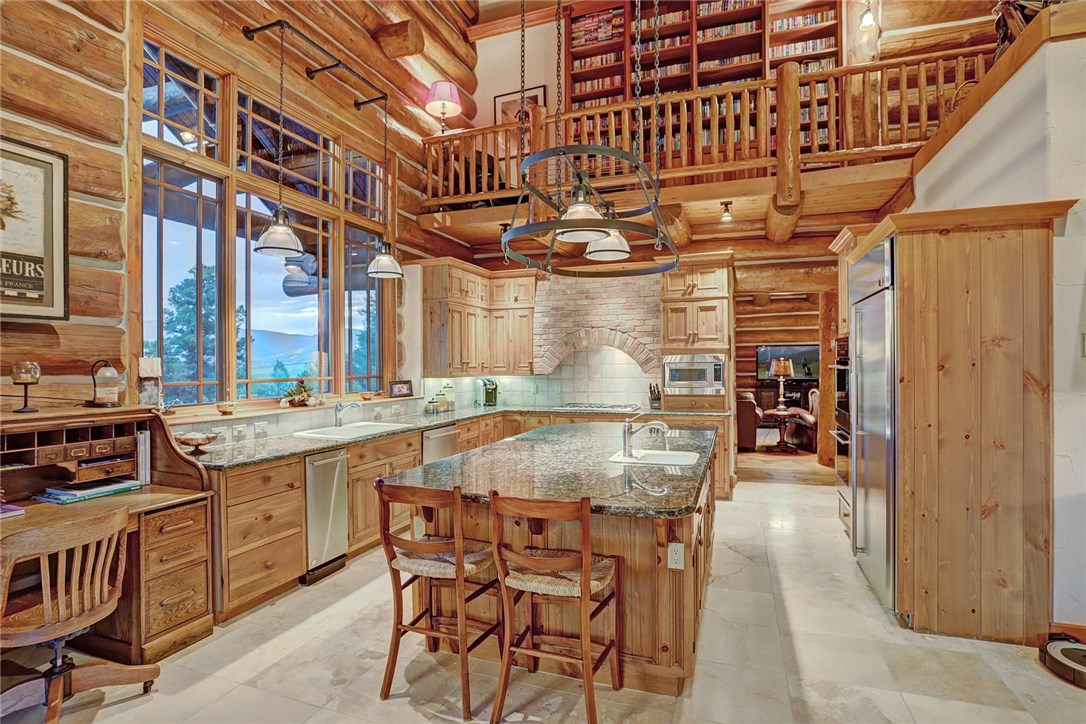 1381 Johnson Road Silverthorne, CO 80498 - Photo 11 of 35 Complete with stainless steel appliances, a double oven, and two sinks, this kitchen is warm and welcoming with limitless views of the northern mountains.