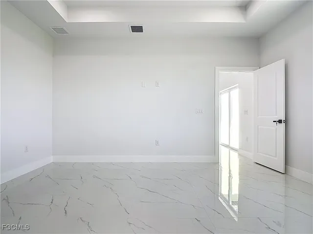an empty room with white door
