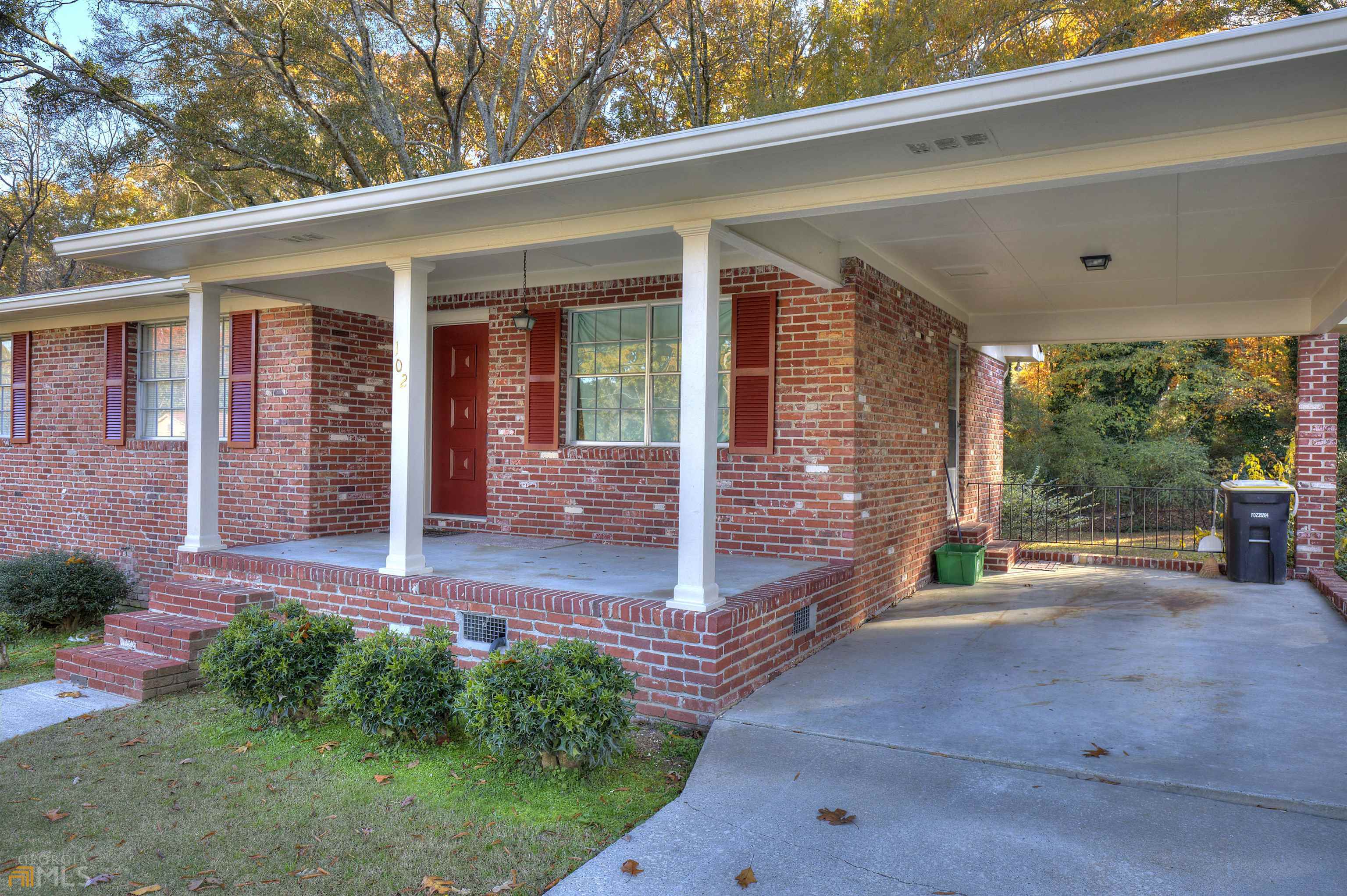 102 Atteiram Drive Rome, GA 30161 - Photo 1 of 1 a view of a porch with chairs and floor to ceiling window