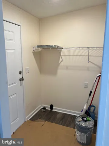 a room with water heater and view of bathroom