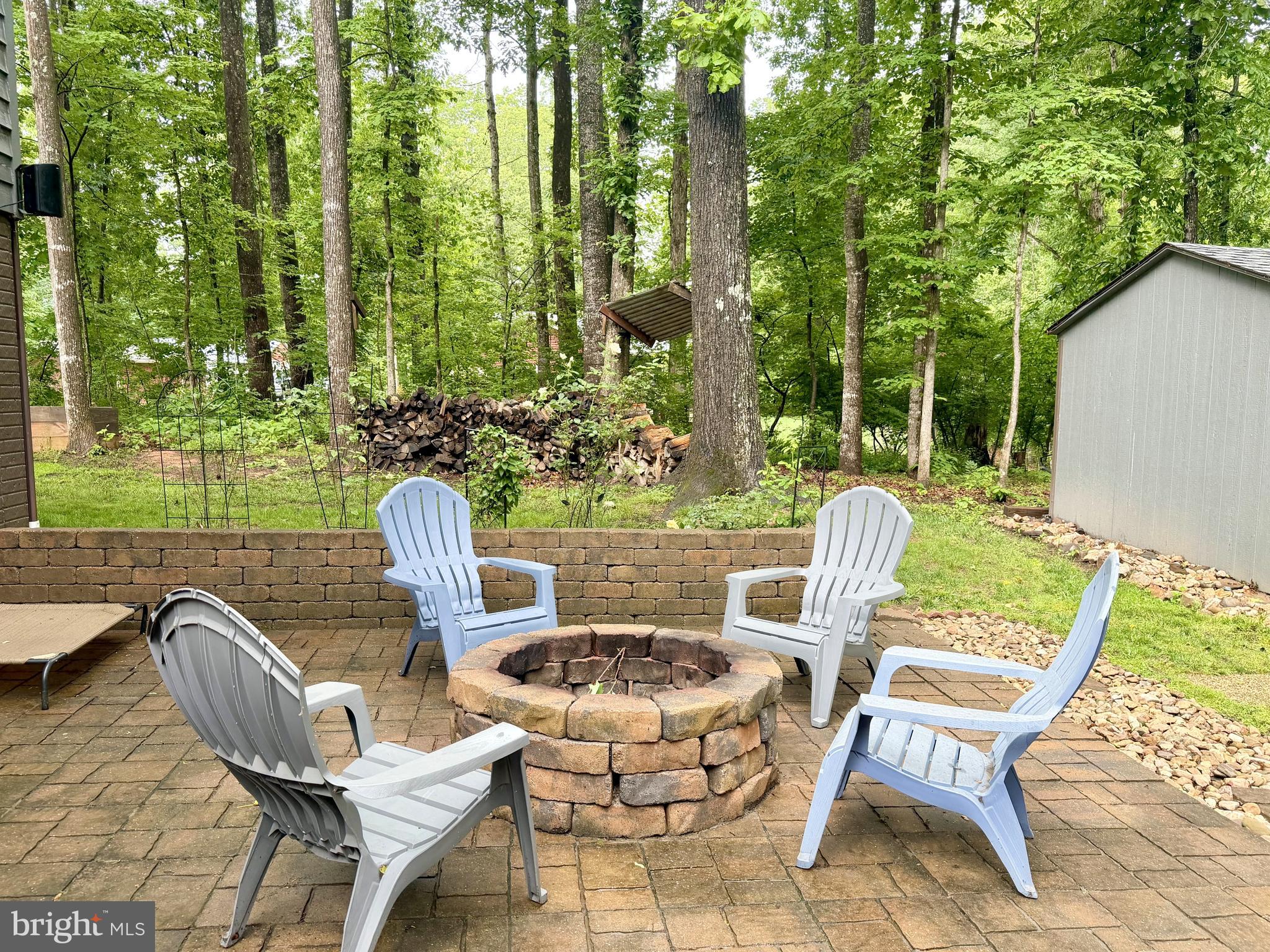 1425 Jacks Shop Road Rochelle, VA 22738 - Photo 53 of 56 Fire pit and patio looking toward the side woods