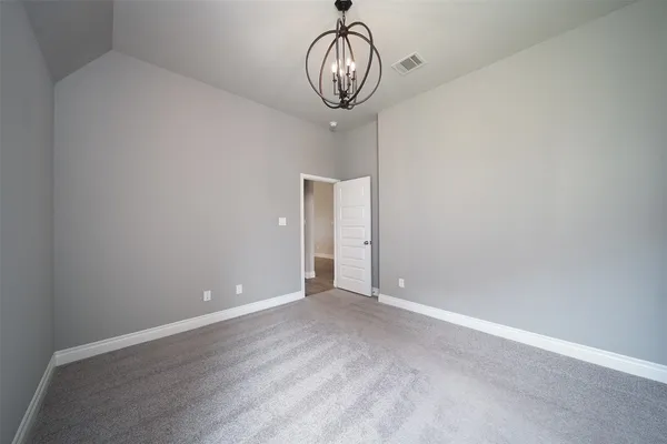 a view of room with wooden floor