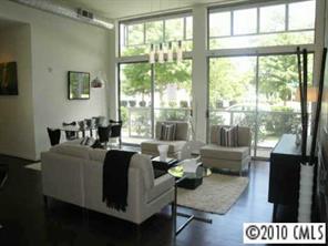 2116 McClintock Road, Unit 213 Charlotte, NC 28205 - Photo 3 of 8 a living room with furniture and a large window