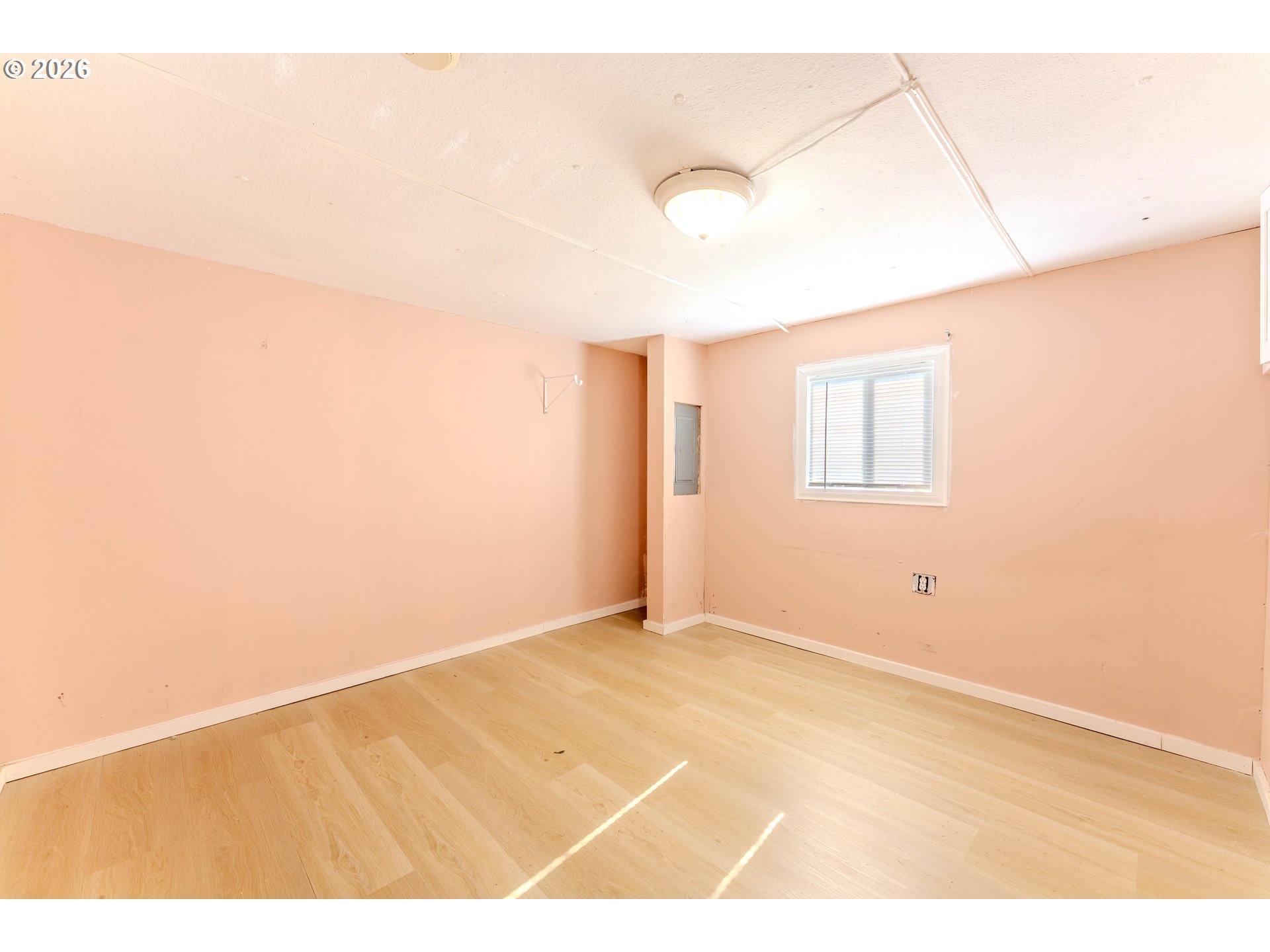1999 Jansen Way, Unit 66 Woodburn, OR 97071 - Photo 16 of 26 a view of an empty room with a window