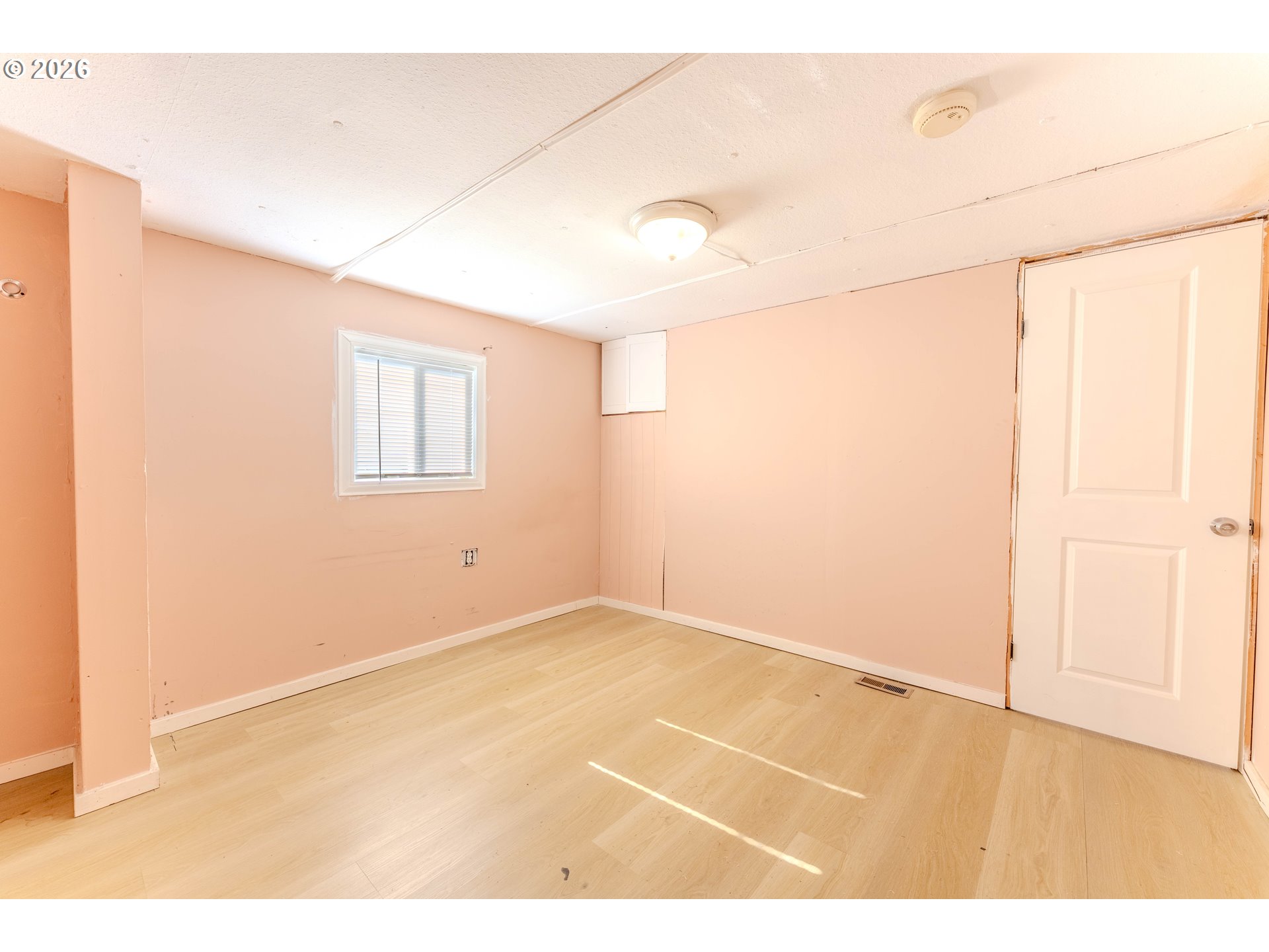 1999 Jansen Way, Unit 66 Woodburn, OR 97071 - Photo 17 of 26 a view of an empty room with a window