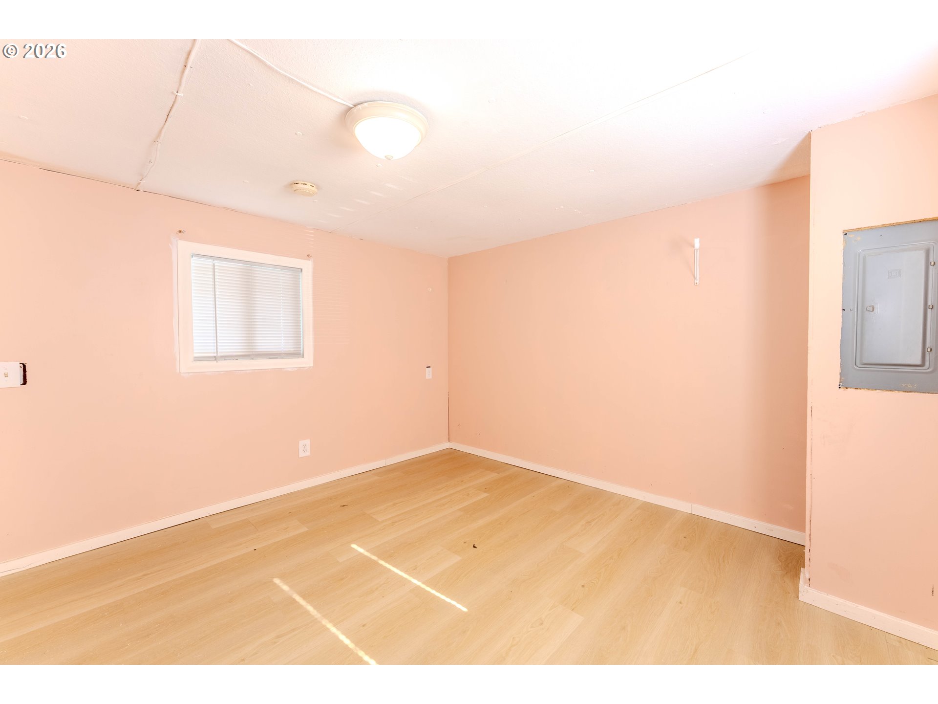 1999 Jansen Way, Unit 66 Woodburn, OR 97071 - Photo 19 of 26 a view of an empty room with a window