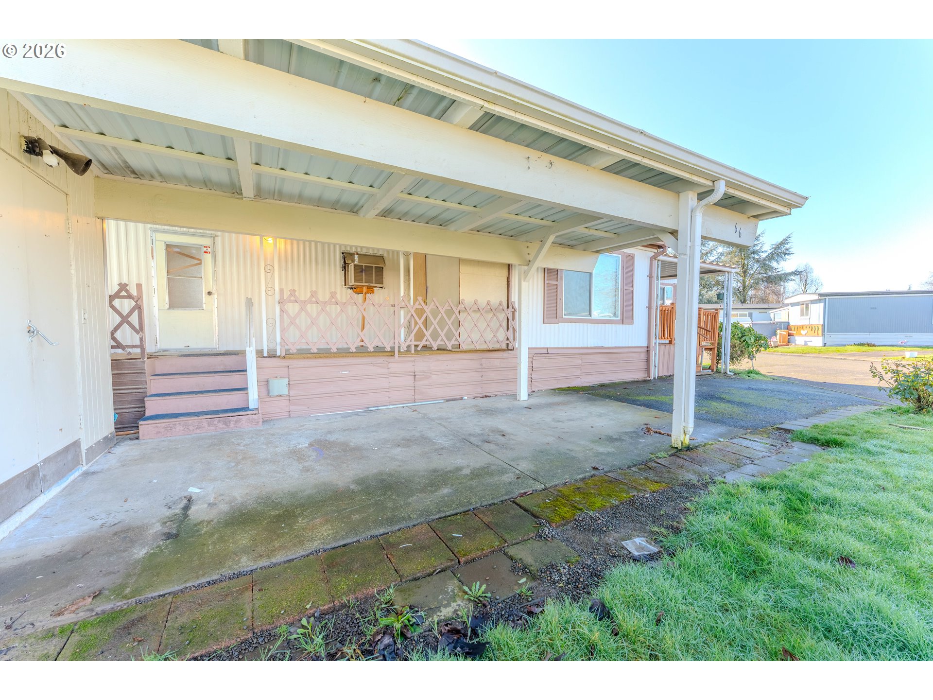 1999 Jansen Way, Unit 66 Woodburn, OR 97071 - Photo 21 of 26 a view of a house with backyard and garden