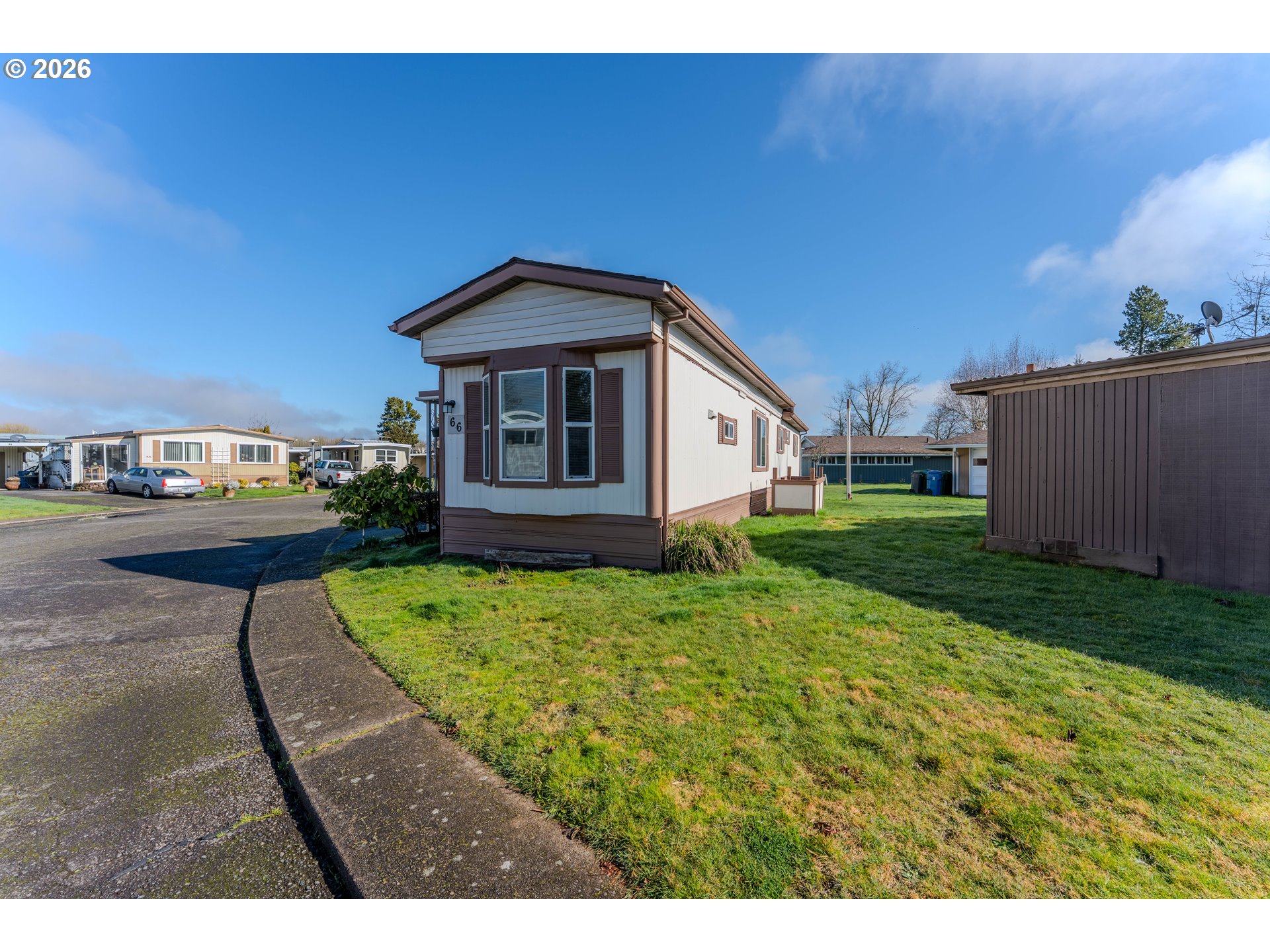 1999 Jansen Way, Unit 66 Woodburn, OR 97071 - Photo 25 of 26 a house view with a garden space