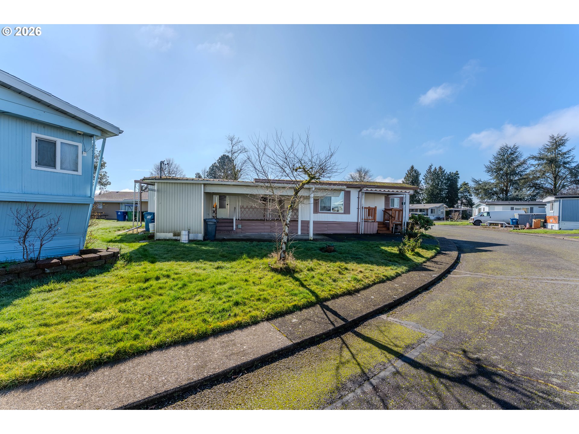 1999 Jansen Way, Unit 66 Woodburn, OR 97071 - Photo 26 of 26 a view of a house with a garden and pathway