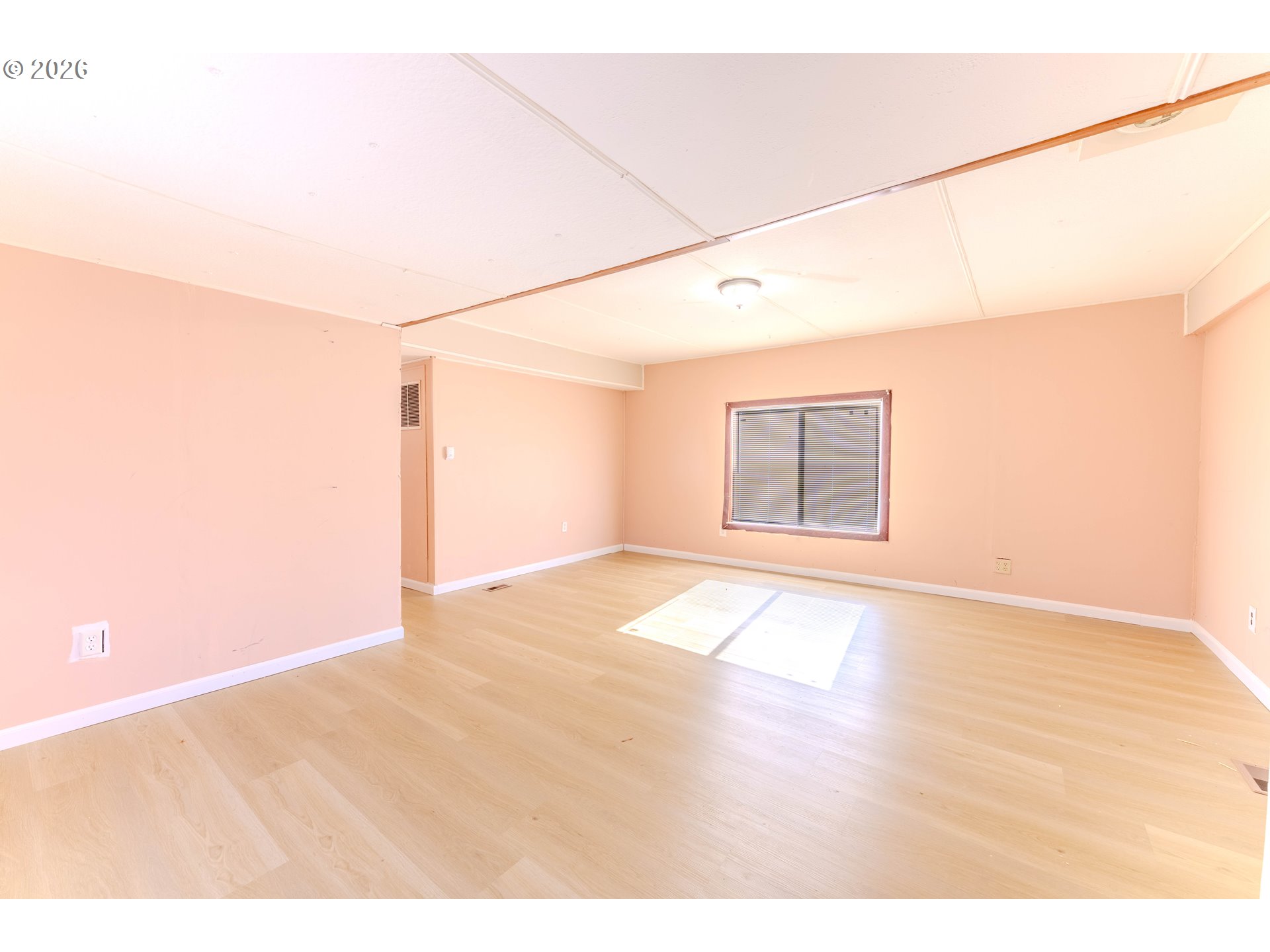 1999 Jansen Way, Unit 66 Woodburn, OR 97071 - Photo 4 of 26 a view of empty room with wooden floor