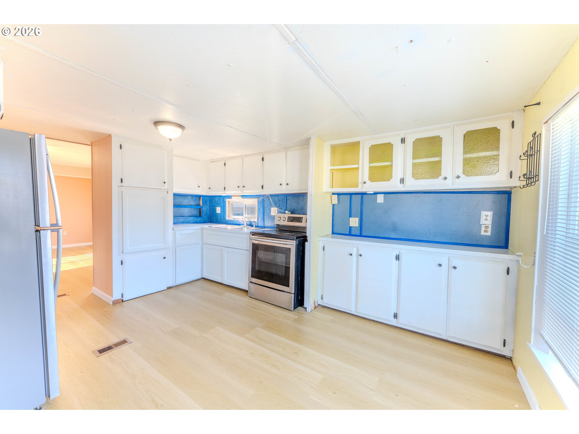 1999 Jansen Way, Unit 66 Woodburn, OR 97071 - Photo 7 of 26 a kitchen with stainless steel appliances granite countertop a stove and a refrigerator