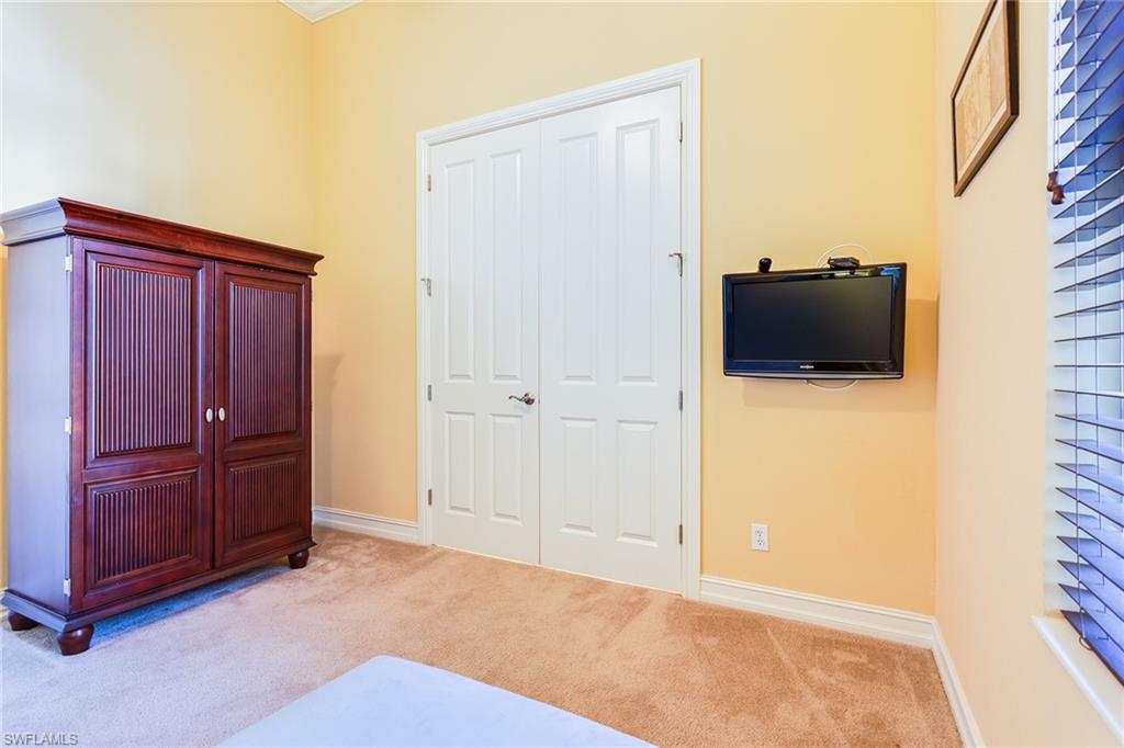 7747 Cottesmore Drive Naples, FL 34113 - Photo 17 of 32 a view of a livingroom with closet