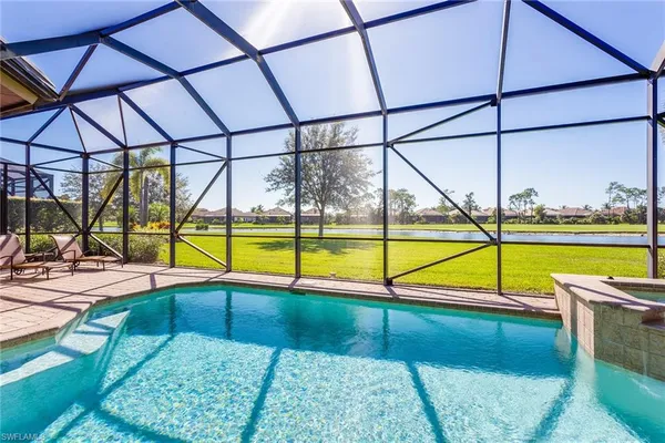 a view of a swimming pool with a lounge chairs