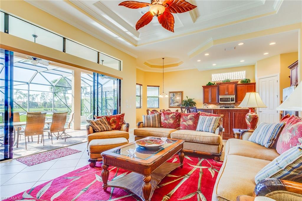 7747 Cottesmore Drive Naples, FL 34113 - Photo 4 of 32 a living room with furniture and a flat screen tv