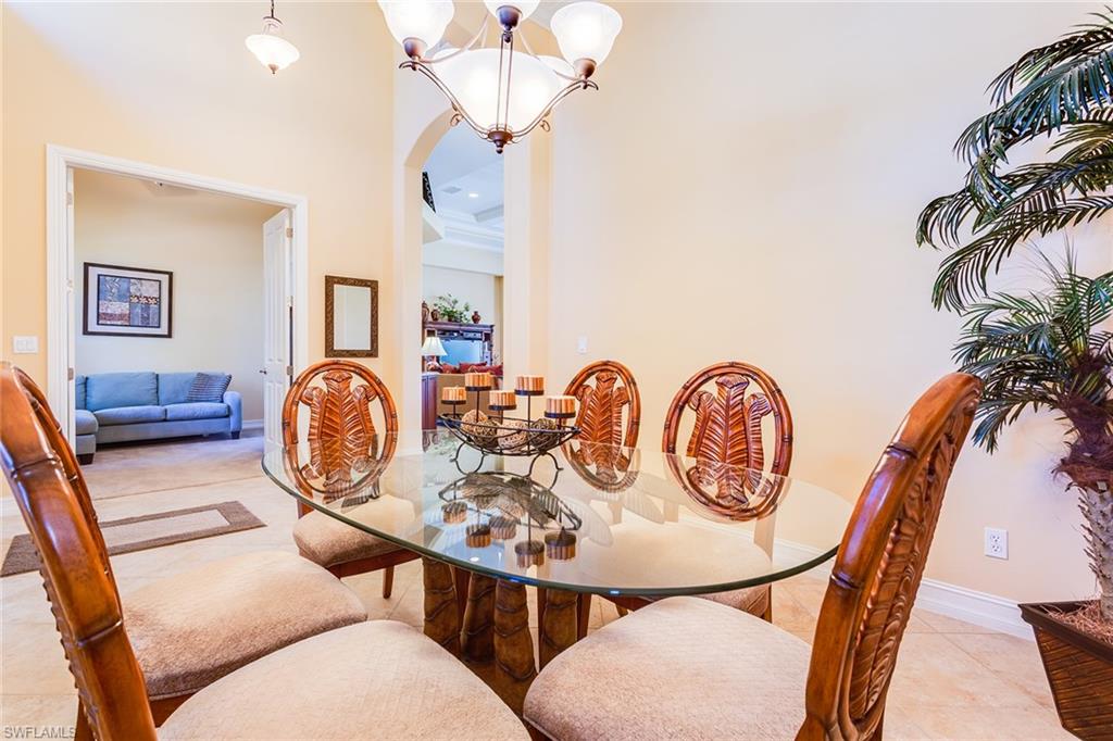 7747 Cottesmore Drive Naples, FL 34113 - Photo 8 of 32 a view of a dining room with furniture