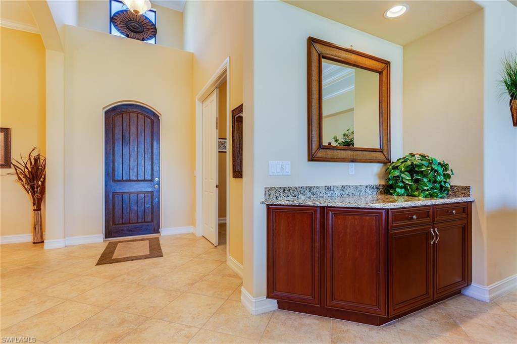 7747 Cottesmore Drive Naples, FL 34113 - Photo 9 of 32 a view of front door