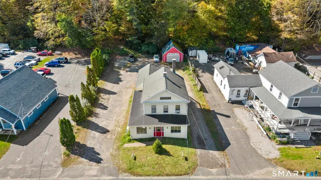 an aerial view of a house with a swimming pool