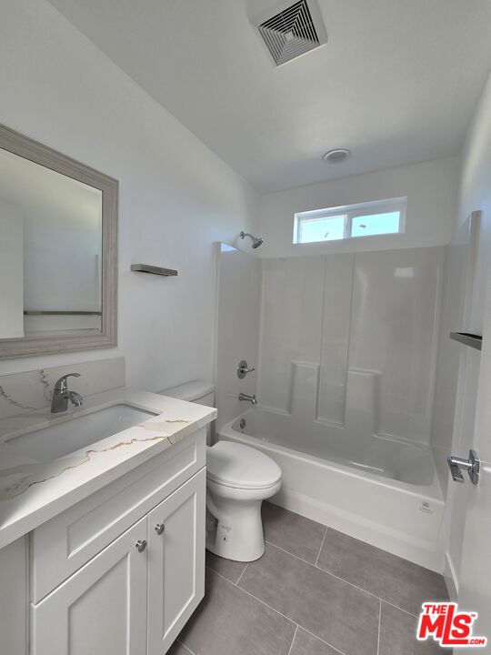 449 West 74th Street Los Angeles, CA 90003 - Photo 11 of 28 a bathroom with a sink a toilet and shower