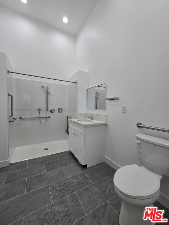 449 West 74th Street Los Angeles, CA 90003 - Photo 18 of 28 a bathroom with a toilet sink and shower