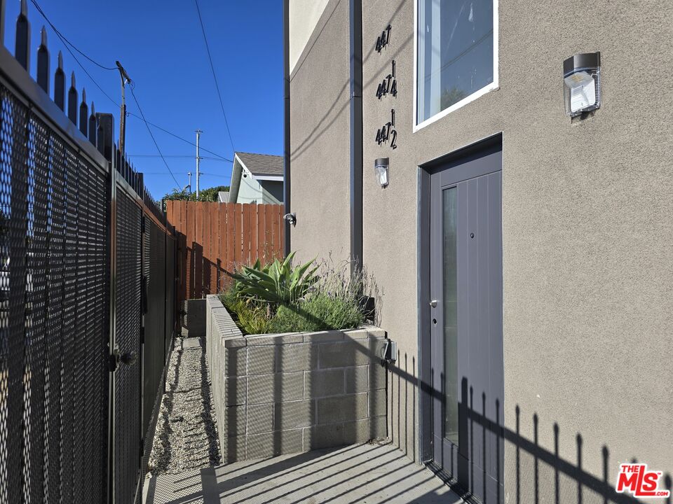449 West 74th Street Los Angeles, CA 90003 - Photo 20 of 28 a view of a house with a potted plant