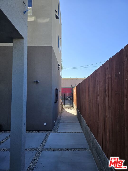 449 West 74th Street Los Angeles, CA 90003 - Photo 22 of 28 a view of a hallway with wooden walls and entryway