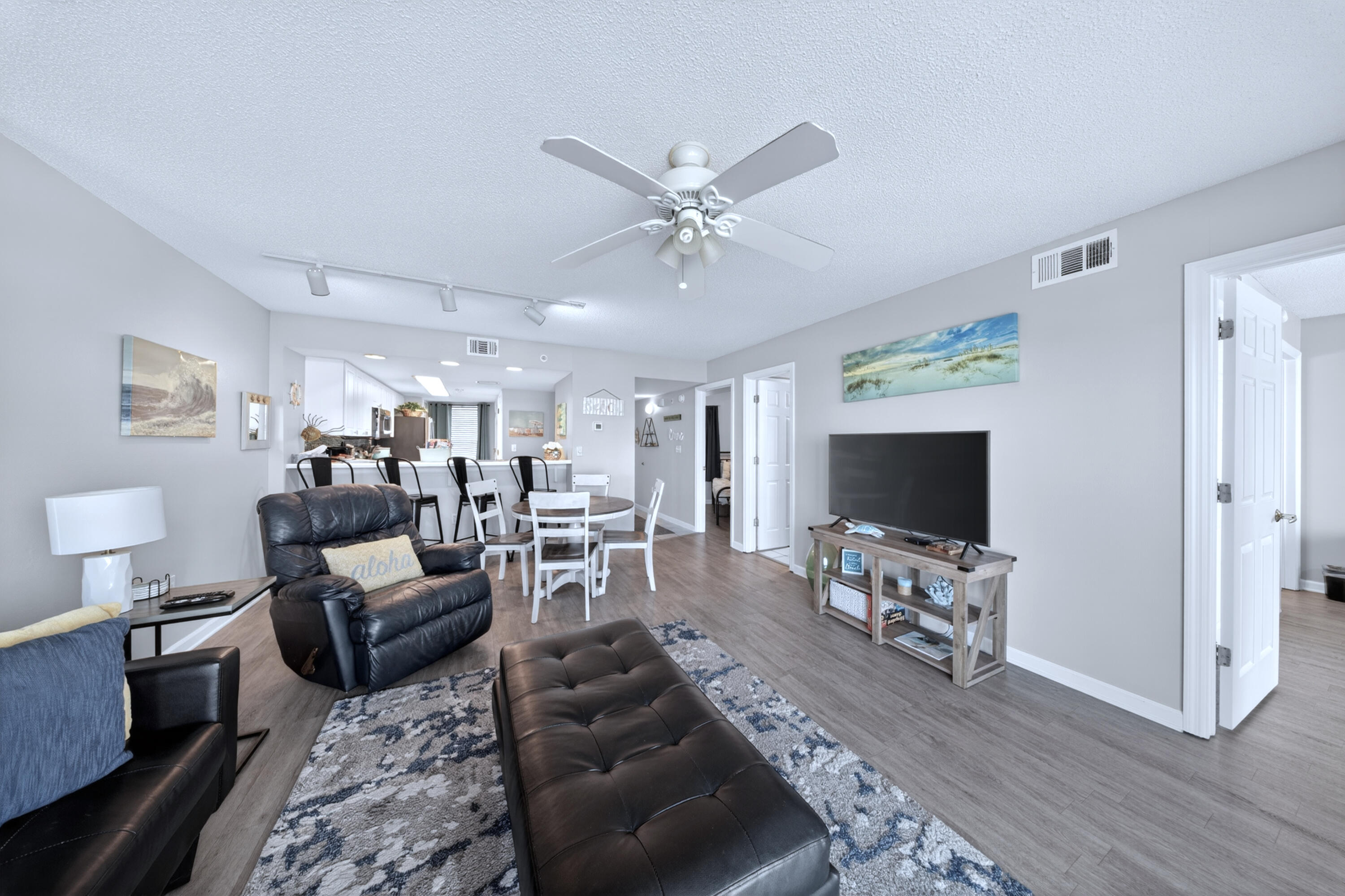 895 Santa Rosa Boulevard, Unit 510 Fort Walton Beach, FL 32548 - Photo 17 of 45 a living room with furniture and a flat screen tv