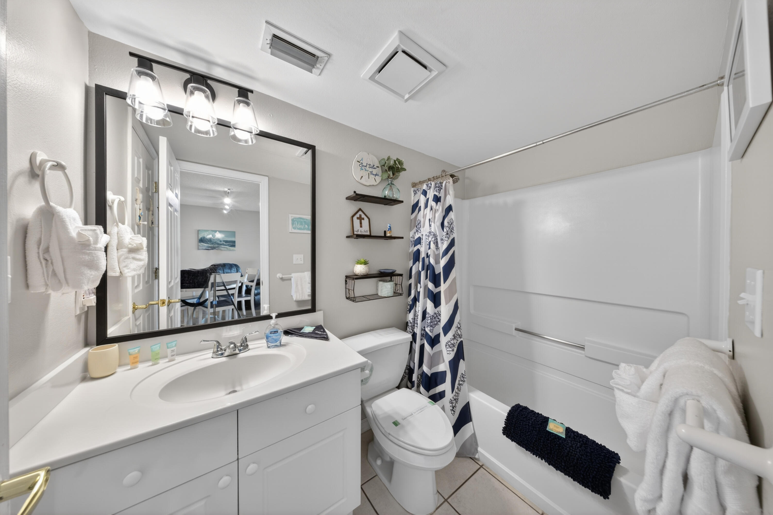 895 Santa Rosa Boulevard, Unit 510 Fort Walton Beach, FL 32548 - Photo 19 of 45 a bathroom with a sink toilet and shower