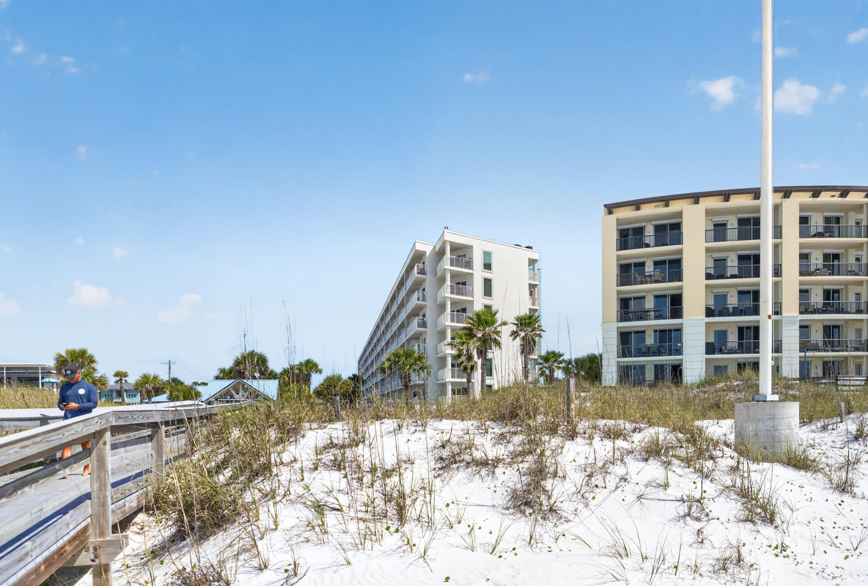 895 Santa Rosa Boulevard, Unit 510 Fort Walton Beach, FL 32548 - Photo 39 of 45 a view of a balcony with chairs and potted plants