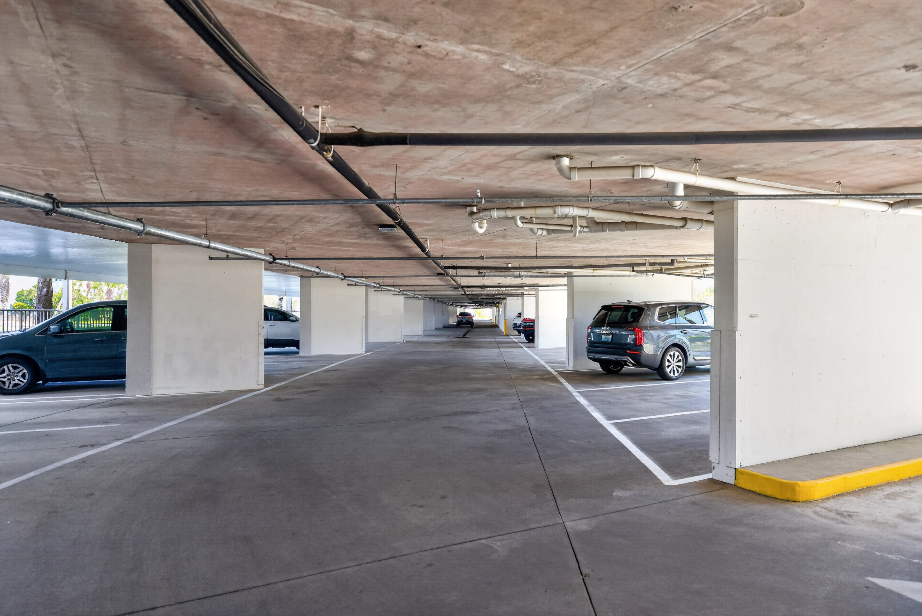 895 Santa Rosa Boulevard, Unit 510 Fort Walton Beach, FL 32548 - Photo 40 of 45 a view of parking garage with cars