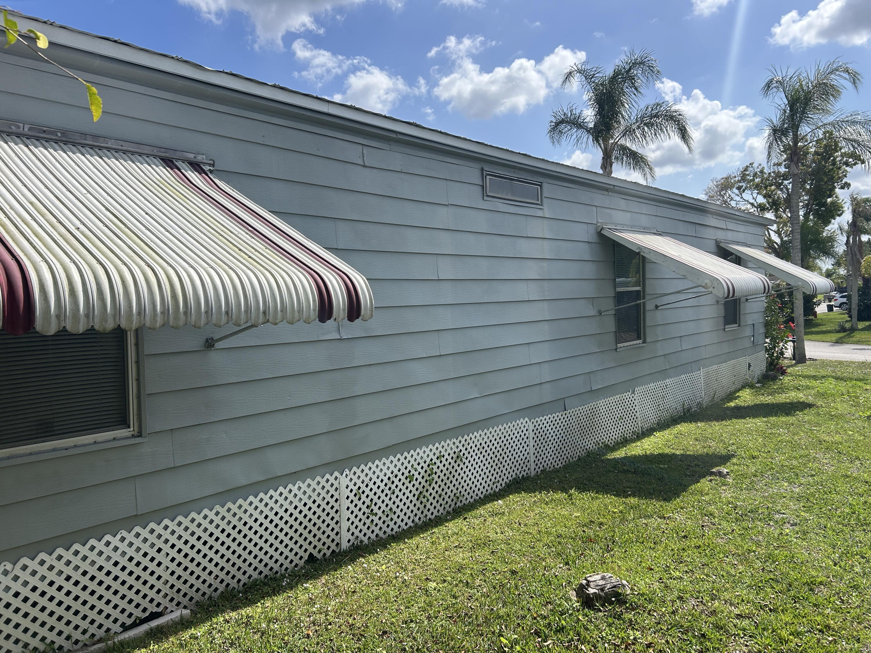 63 Ipanema Way Fort Pierce, FL 34951 - Photo 12 of 49 a view of a balcony with a chair