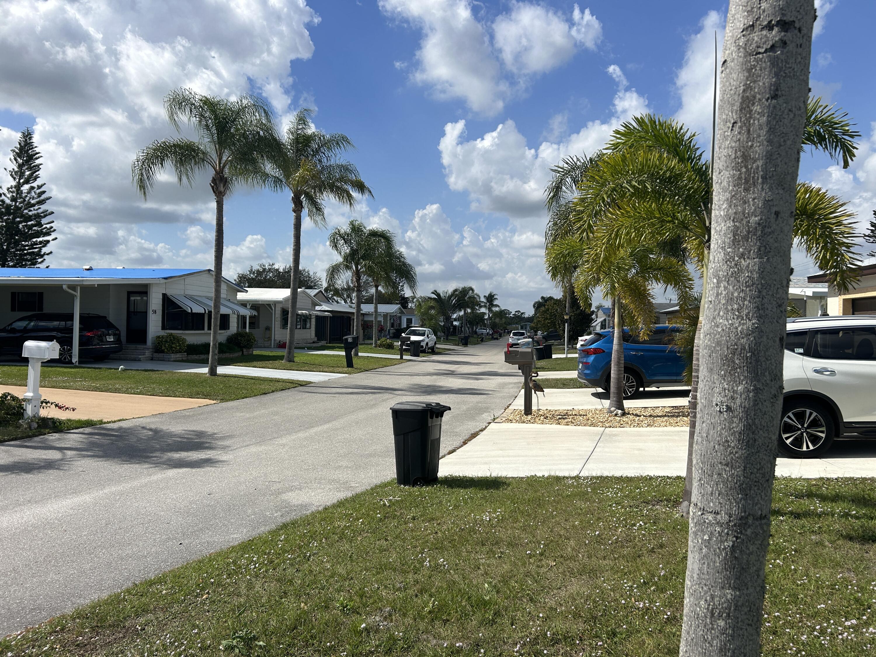 63 Ipanema Way Fort Pierce, FL 34951 - Photo 15 of 49 a view of a house with swimming pool and sitting area