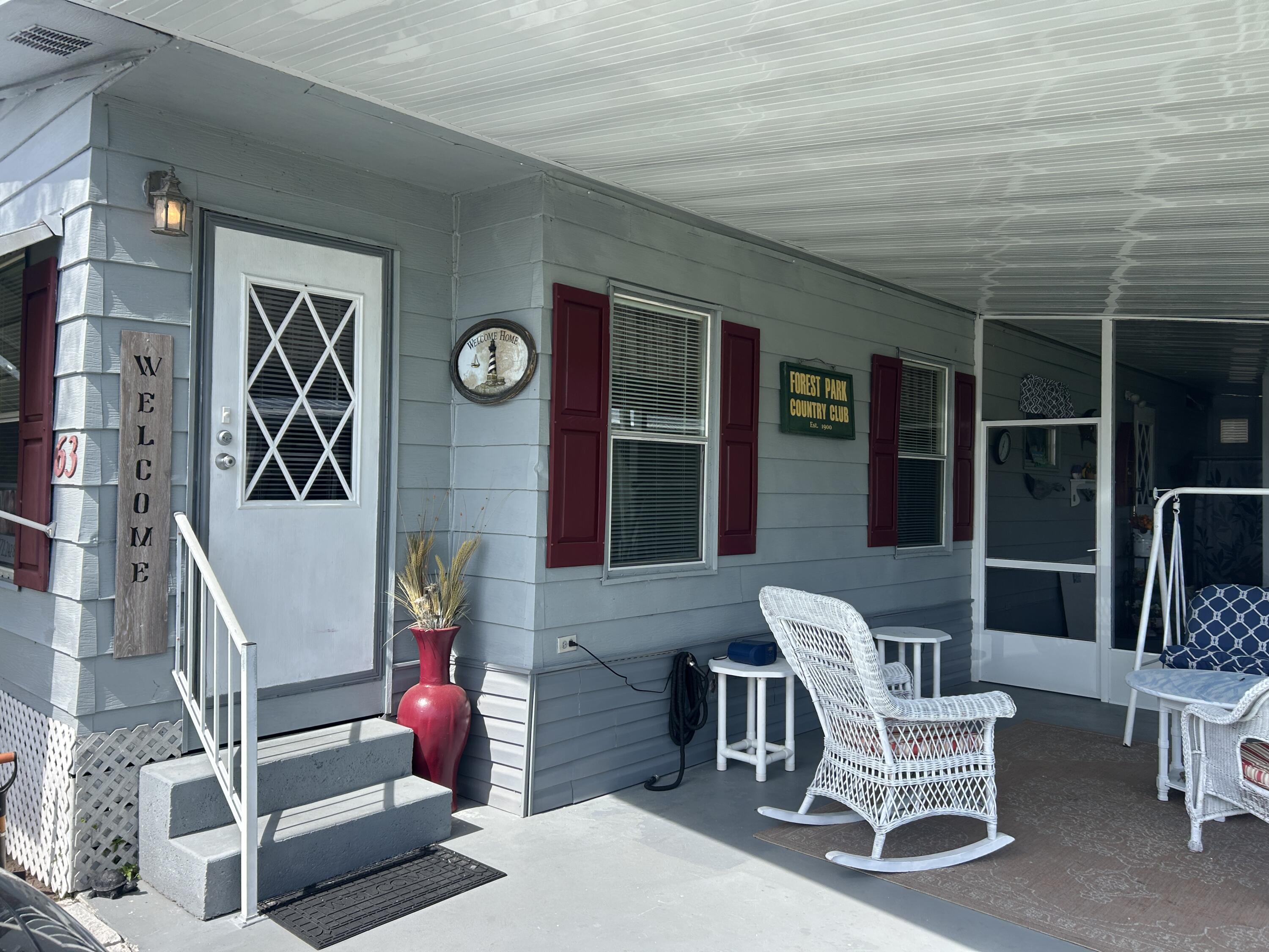 63 Ipanema Way Fort Pierce, FL 34951 - Photo 17 of 49 a group of chairs sitting in front of a building
