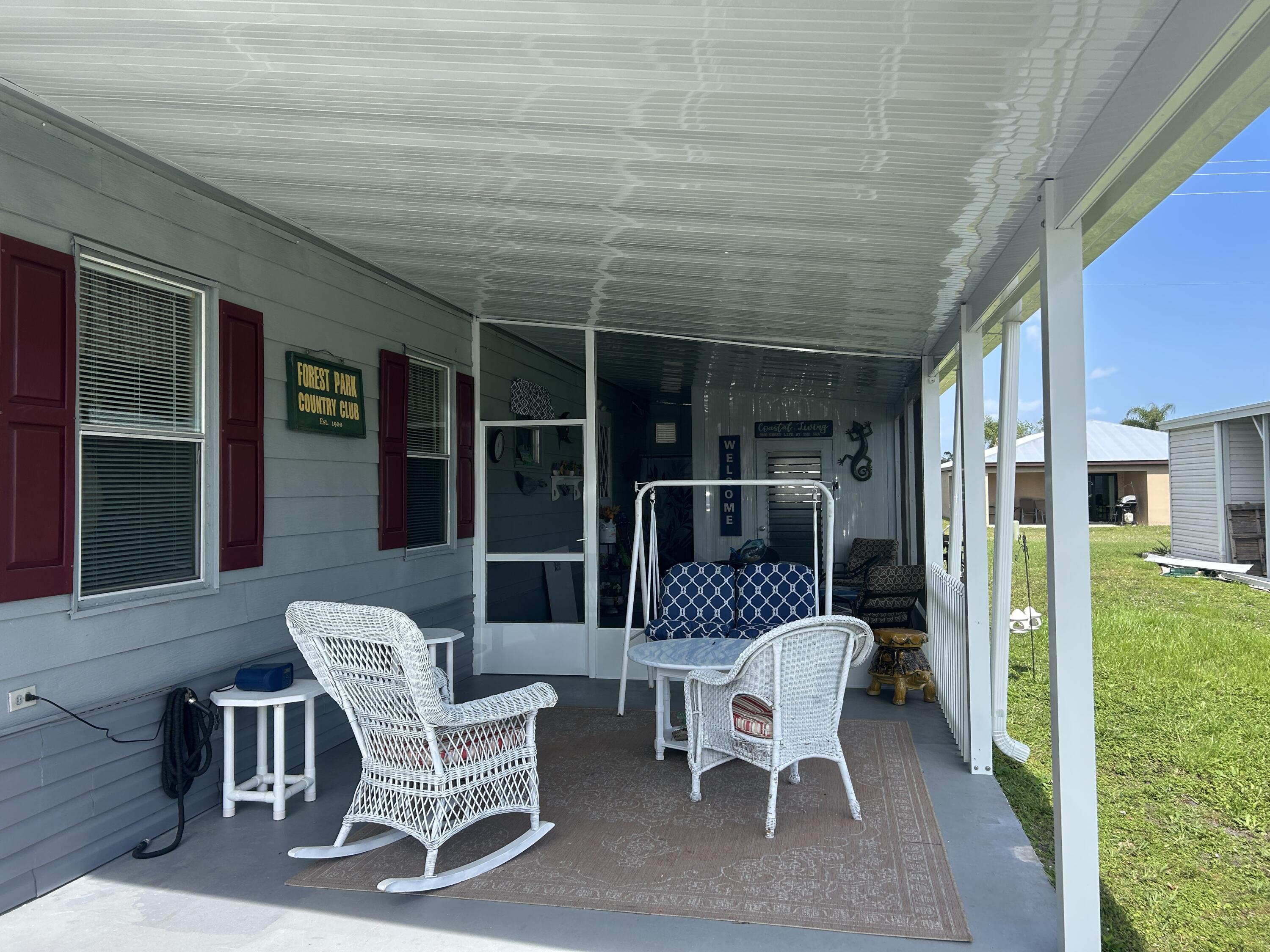 63 Ipanema Way Fort Pierce, FL 34951 - Photo 18 of 49 a couple of chairs sitting in front of a house
