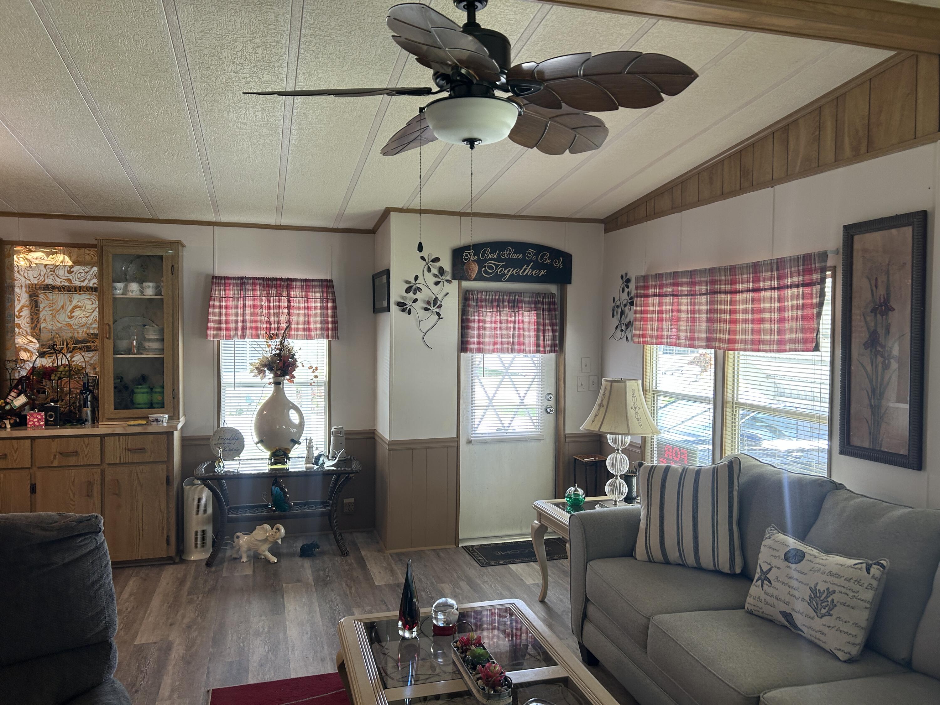 63 Ipanema Way Fort Pierce, FL 34951 - Photo 26 of 49 a living room with furniture and wooden floor
