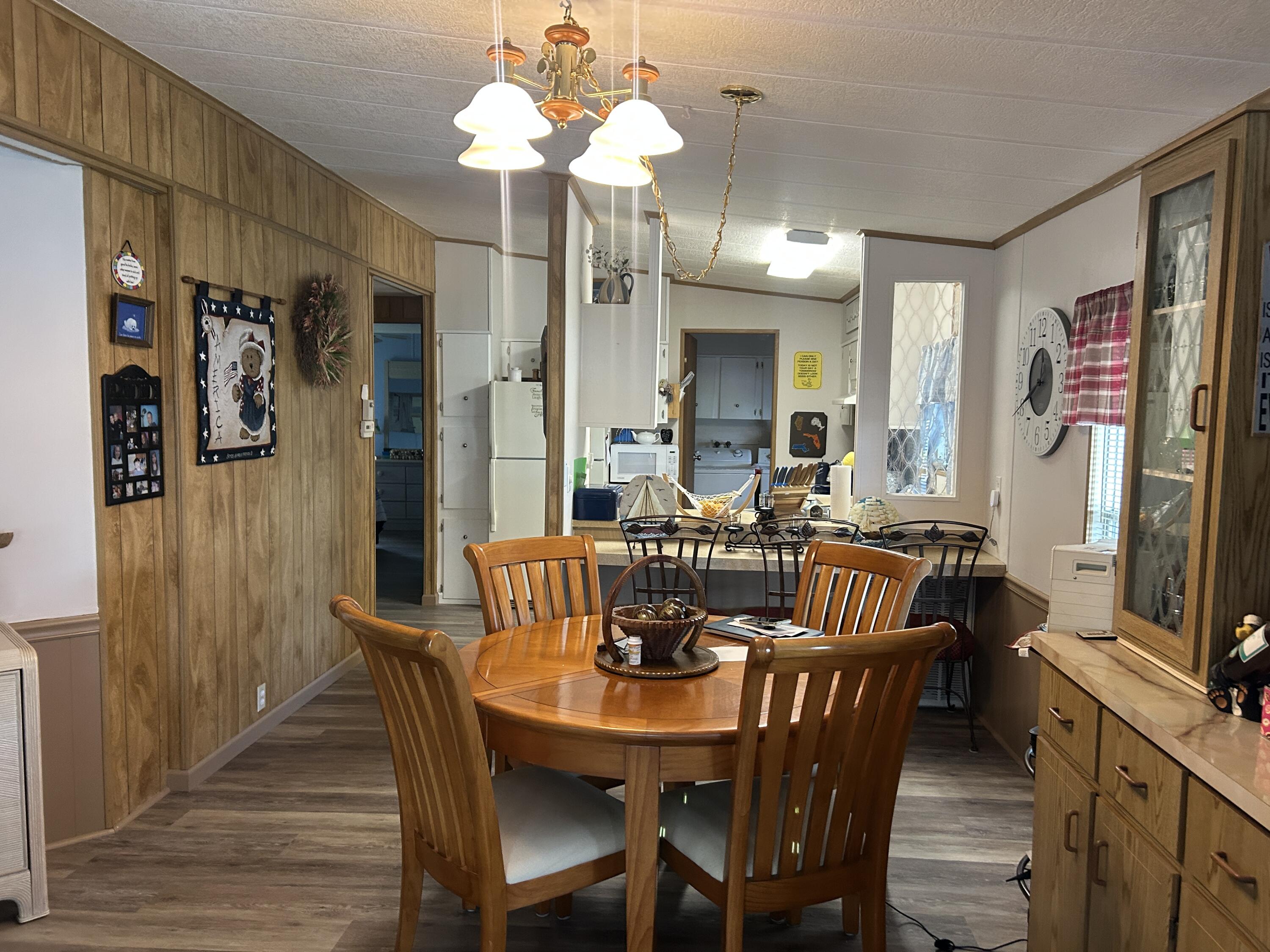 63 Ipanema Way Fort Pierce, FL 34951 - Photo 27 of 49 a view of a a dining room with furniture window and wooden floor