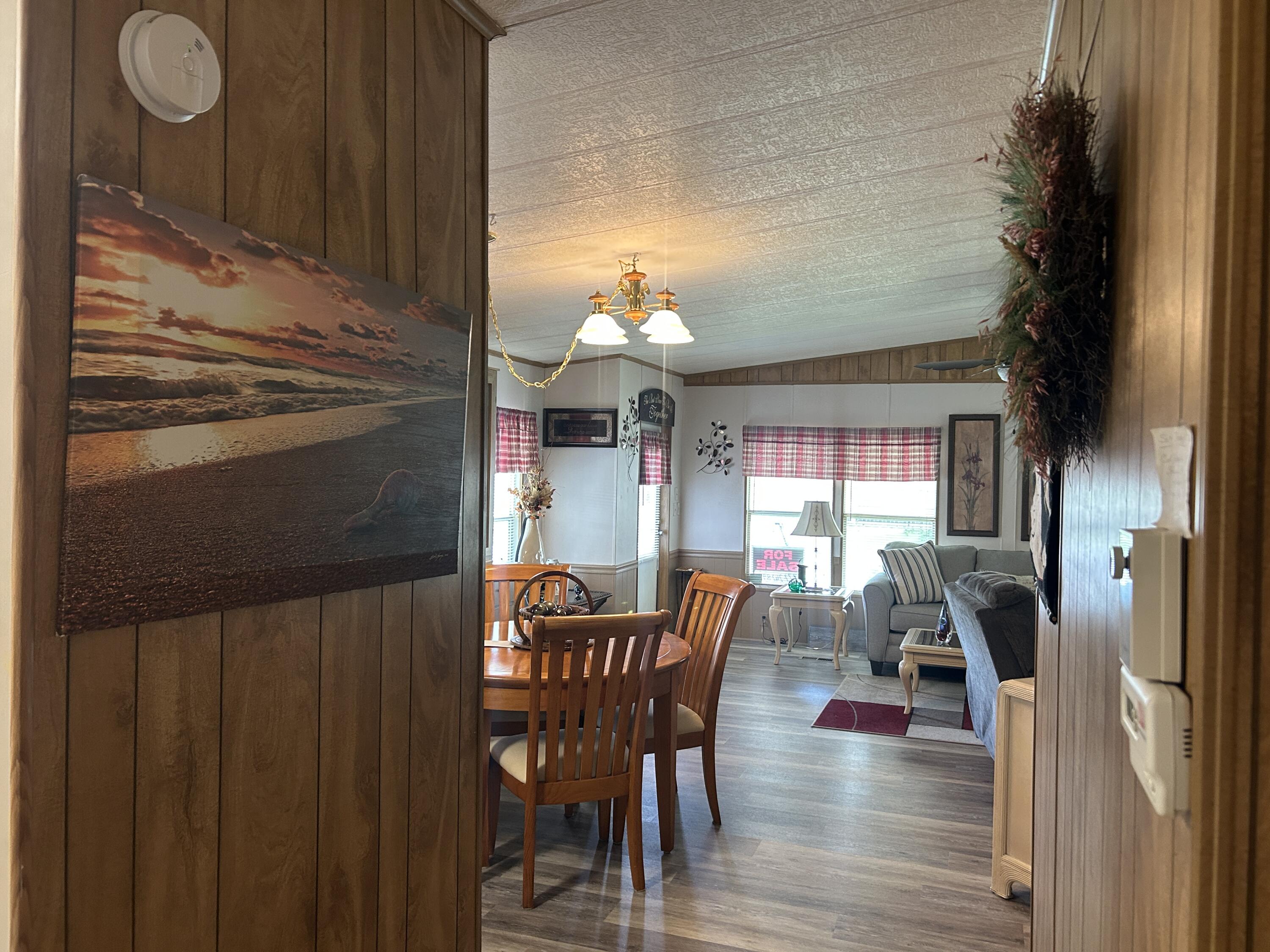 63 Ipanema Way Fort Pierce, FL 34951 - Photo 31 of 49 a dining room with furniture and wooden floor